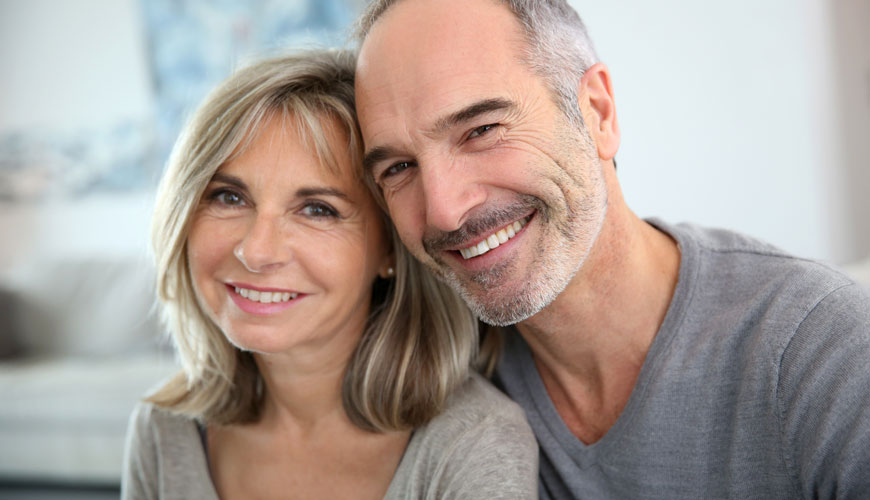 Older couple smiling at Chelsea Dexter Dental Group in Chelsea & Dexter, MI